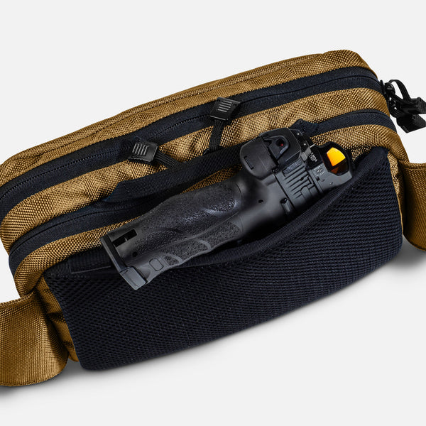 TRGR Logan CCW Waist Pack, Coyote Brown, view of pistol protruding from hidden pocket 