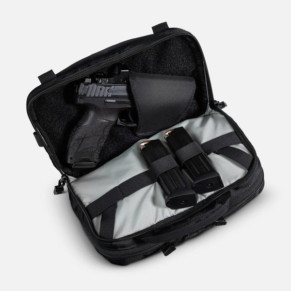 TRGR Logan CCW Waist Pack With MOLLE, Stealth Black, view of rear compartment with pistol and magazines