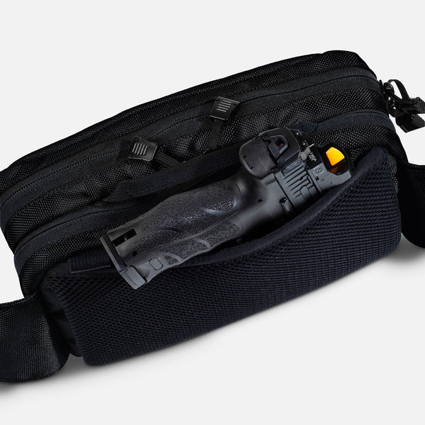 TRGR Logan CCW Waist Pack With Loop, Stealth Black, view of pistol protruding from hidden pocket