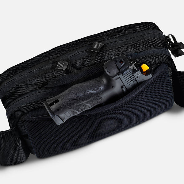 TRGR Logan CCW Waist Pack, Stealth Black With MOLLE, view of pistol protruding from hidden pocket